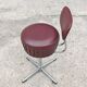 Set of 4 Mid Century Modern swivel chairs in tubular steel and leather.