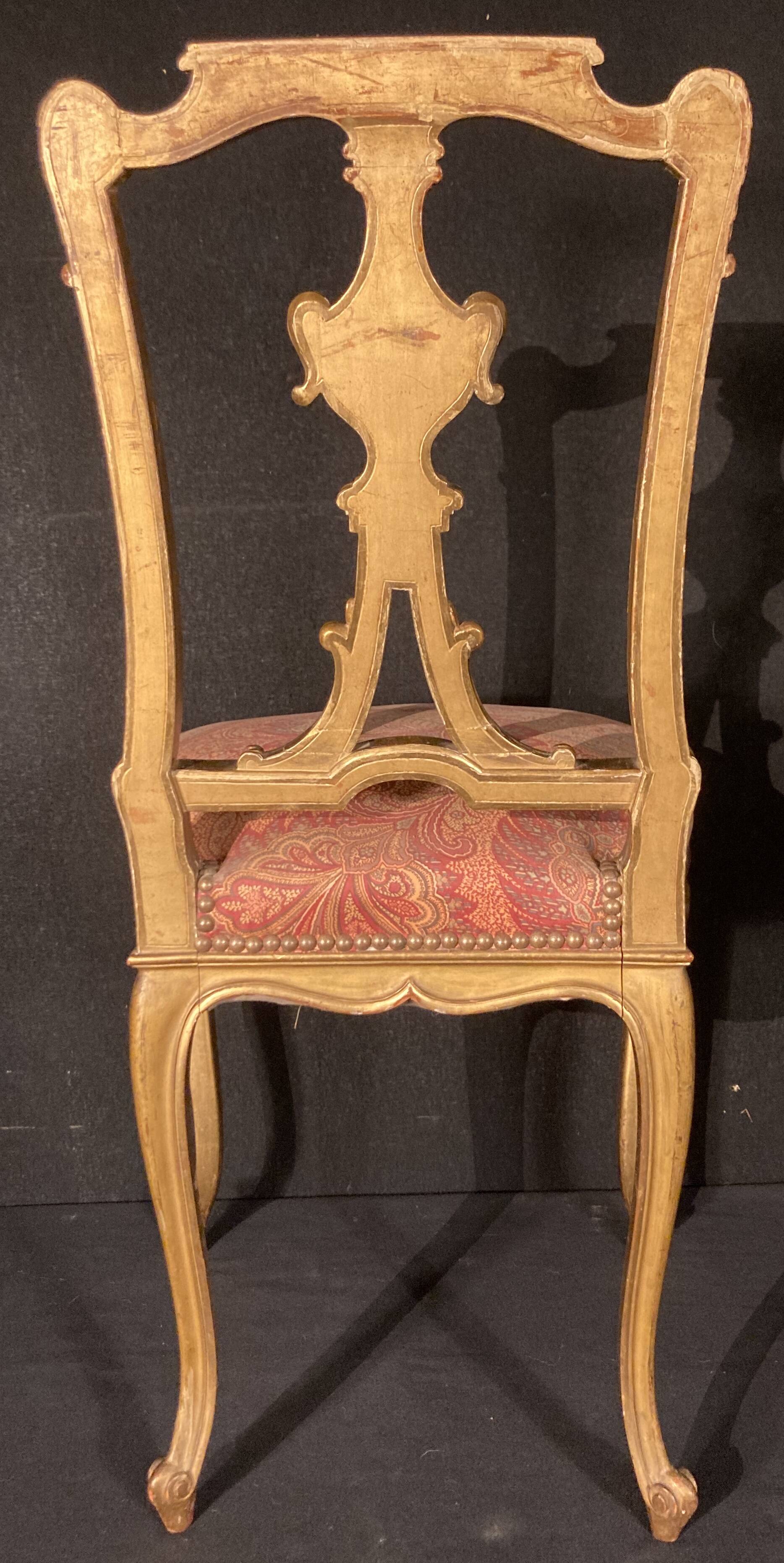 Pair of gilded wooden chairs