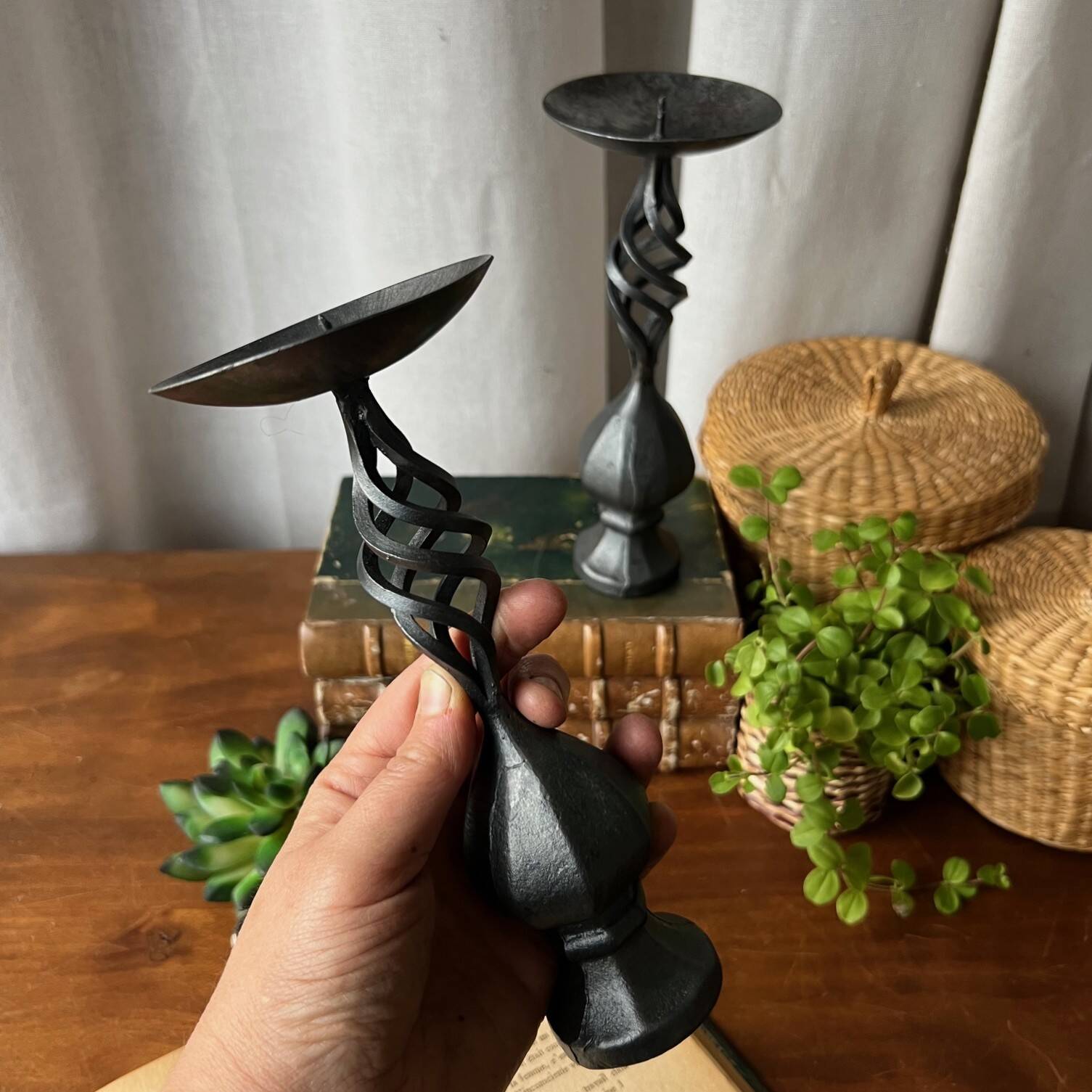 Pair of wrought iron candlesticks, black patina