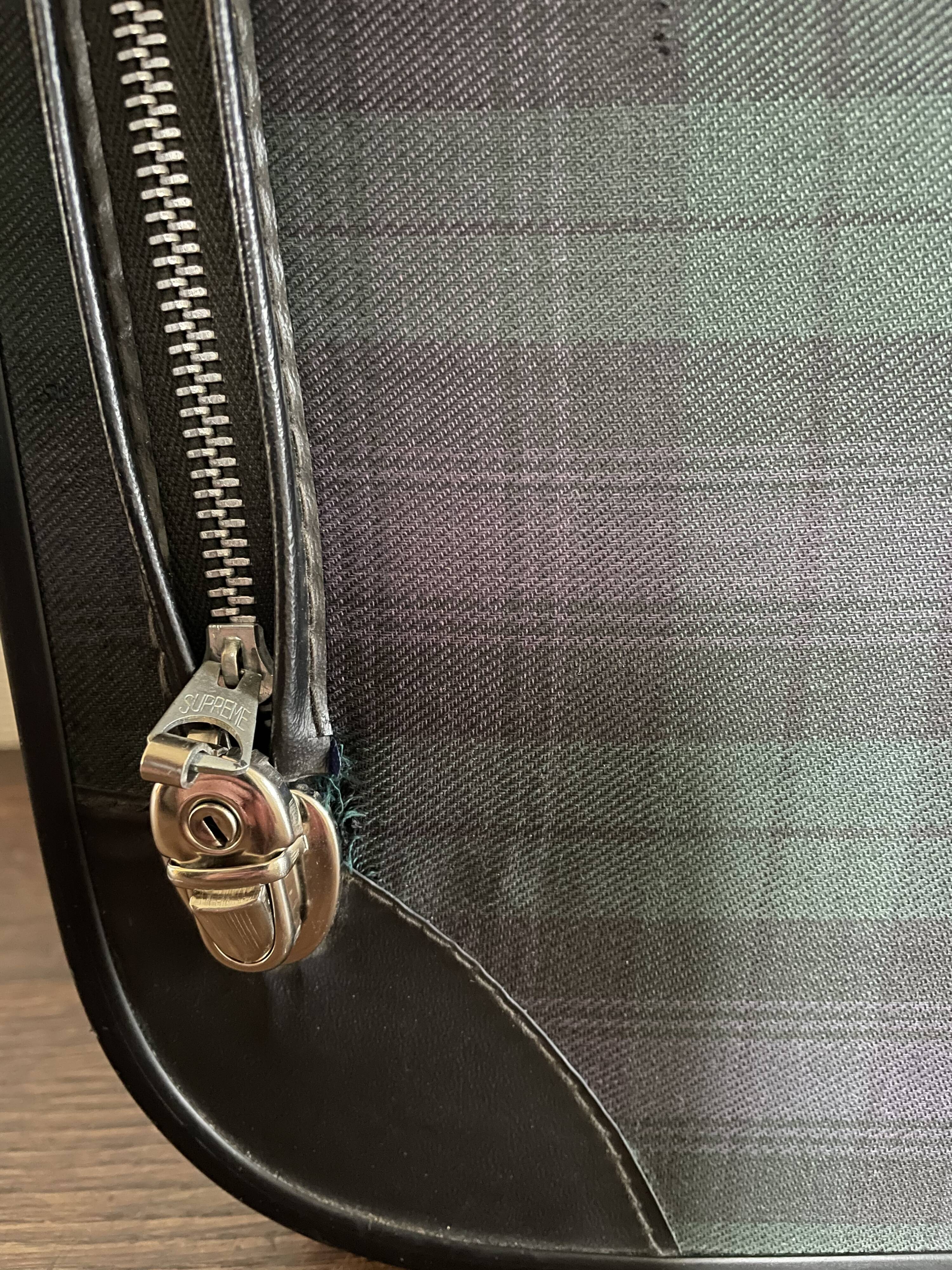 Tartan check suitcase