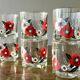 The service of 6 whiskey glasses with red flowers, with its bucket and its ice cube tongs.