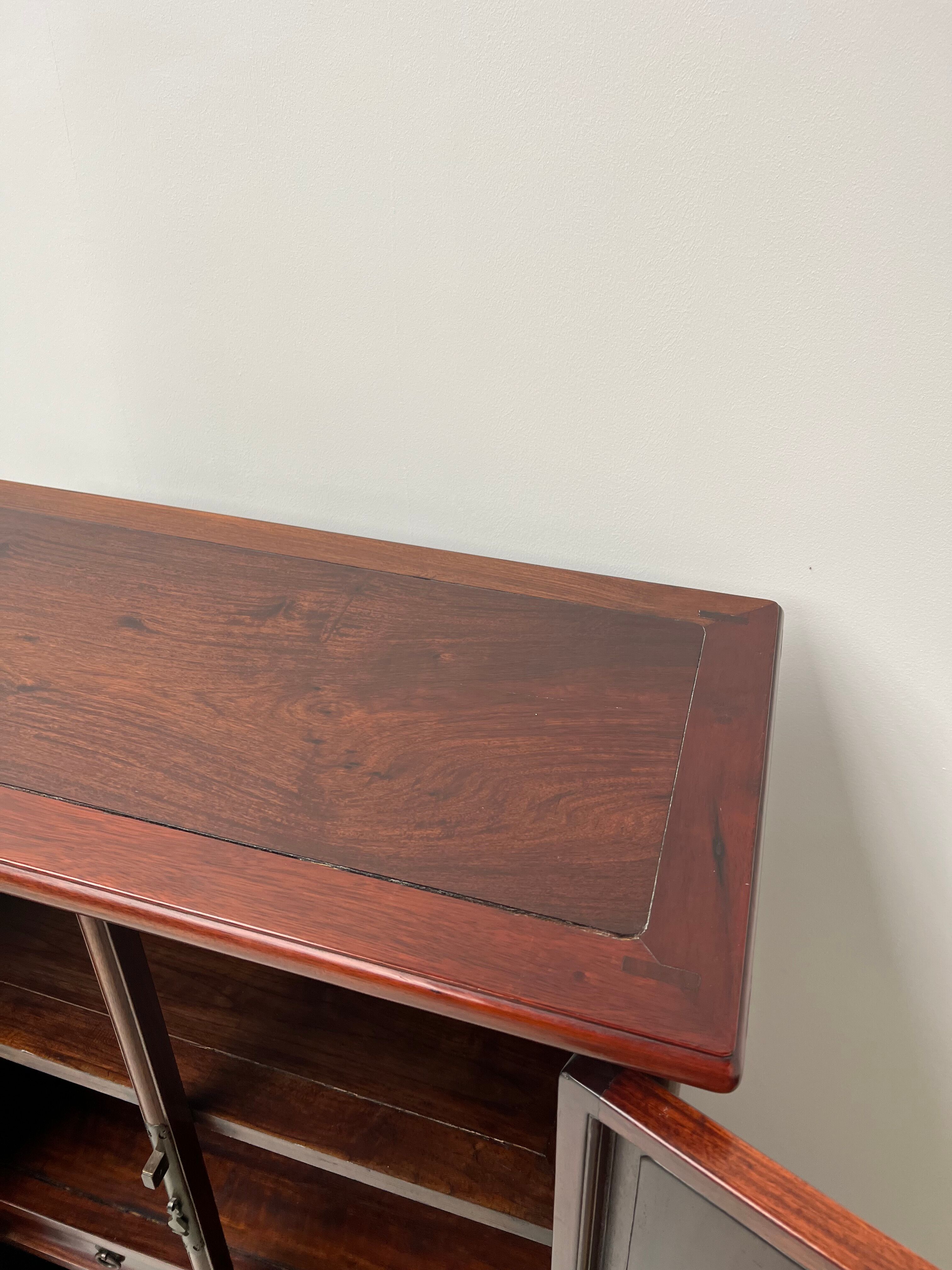 Chinese trapezoidal roller cabinet, made of rosewood.
