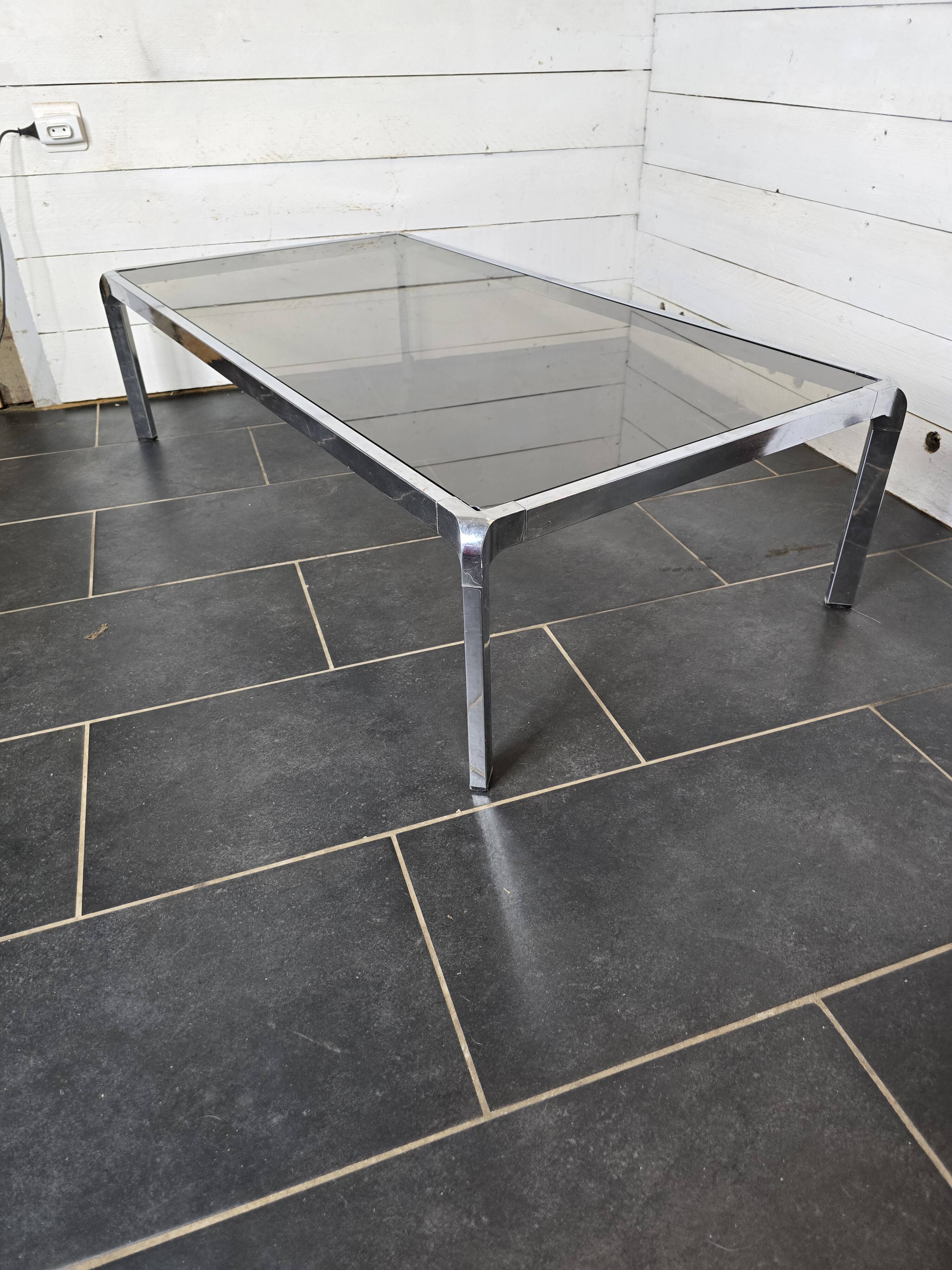 Chromed metal coffee table with smoked glass top from the 70s