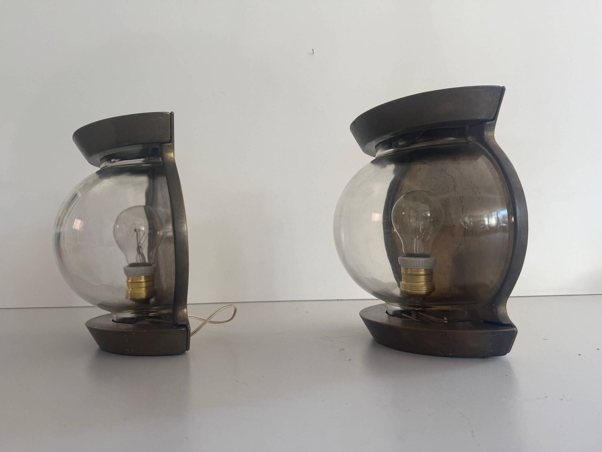 Pair of bronze and glass wall lights from the mid-century, 1960, Italy.