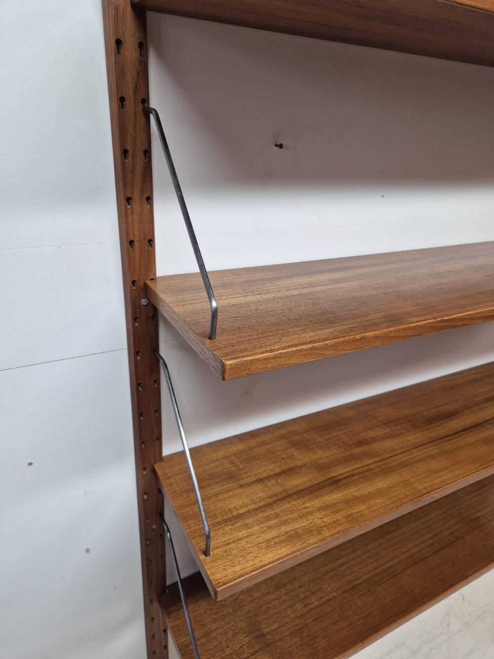 Teak shelving system, marked made in Denmark, 1960.