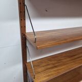 Teak shelving system, marked made in Denmark, 1960.