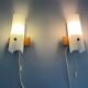 Mid-century wall lights in white plexiglass with a wooden base, 1960s, Germany.