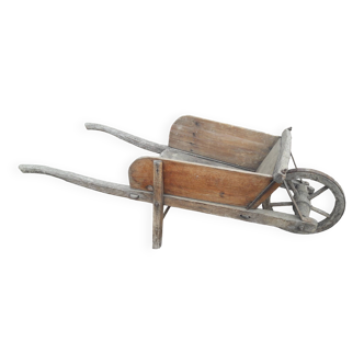 Old wooden wheelbarrow for children