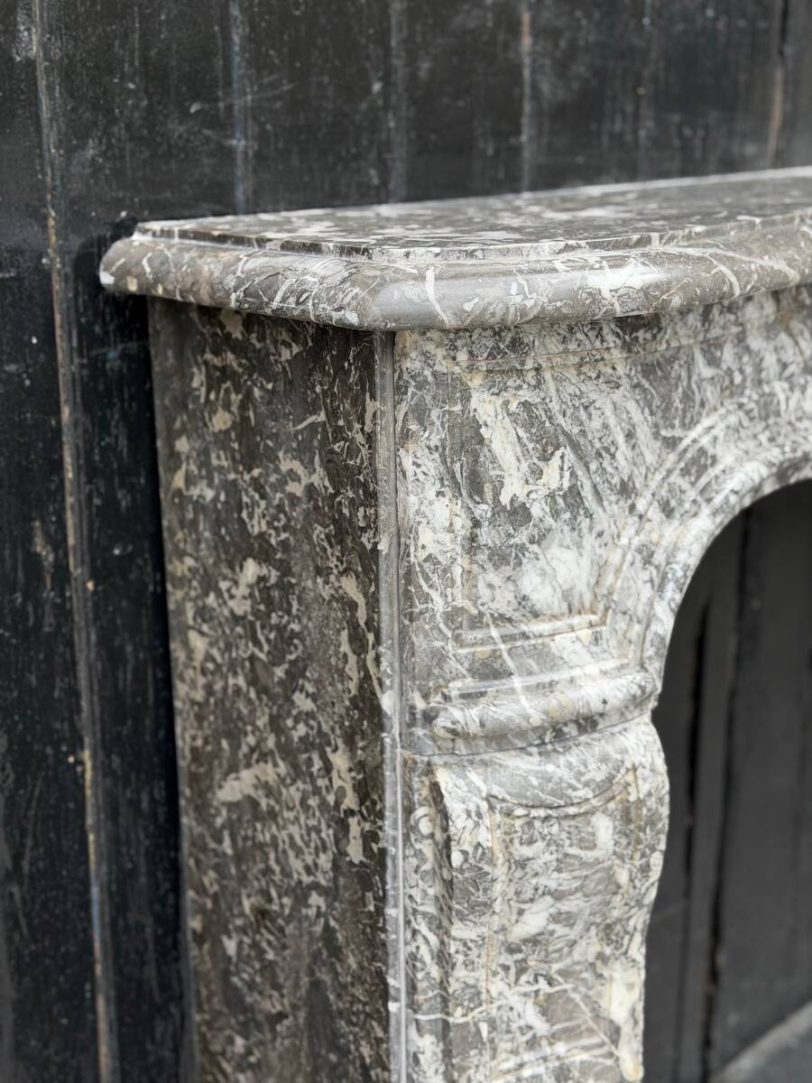 Louis XV fireplace in grey Saint Anne marble, 18th century.