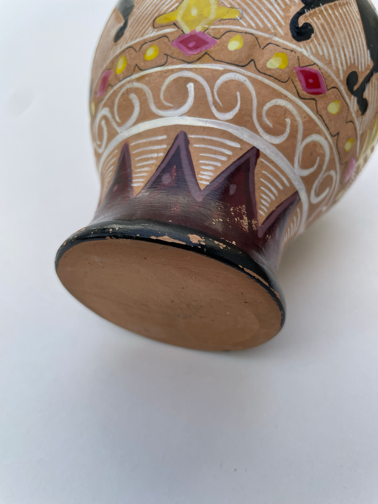 Clay pitcher with a bird head