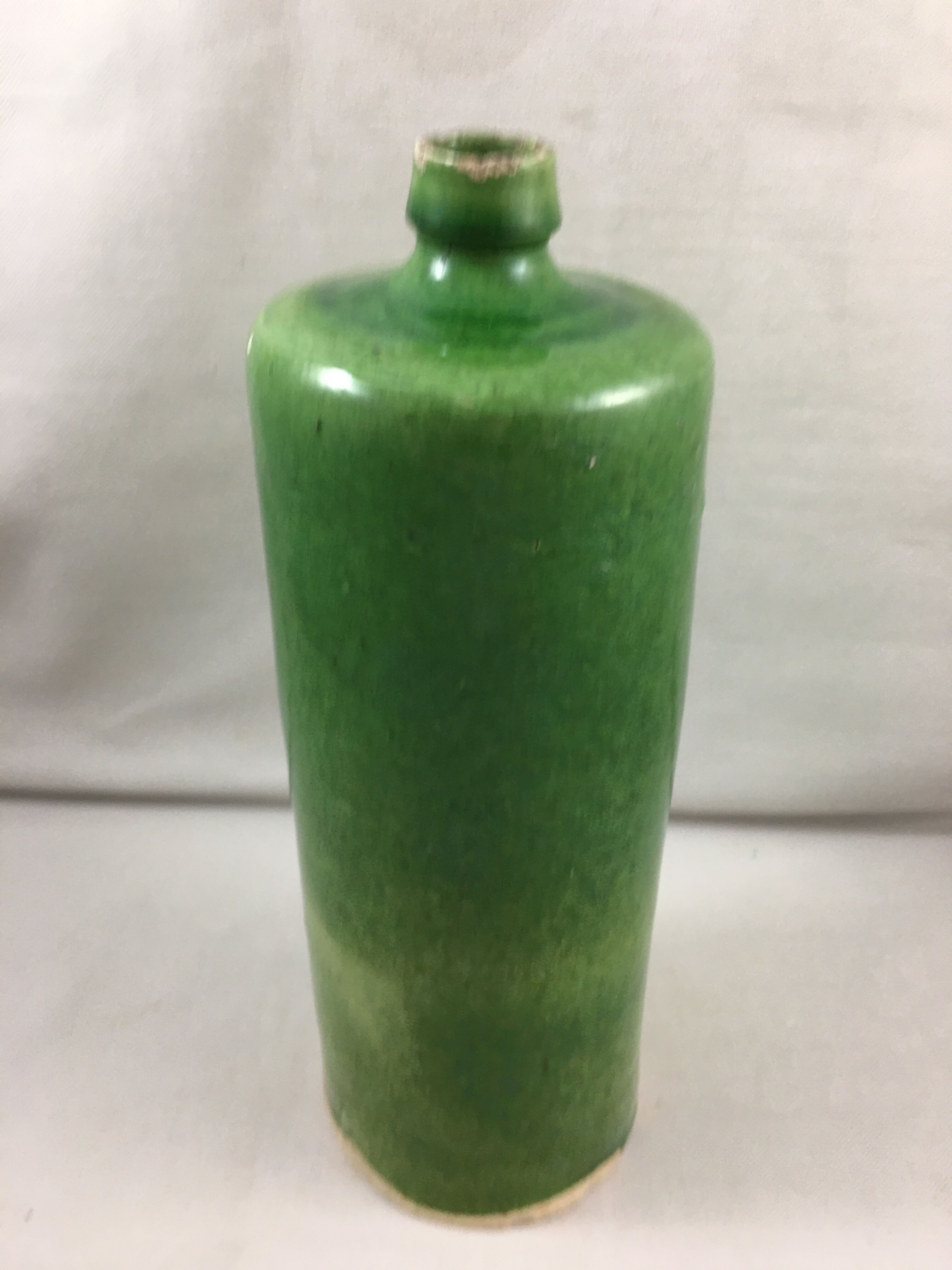 Green glazed terracotta bottle deco