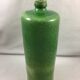Green glazed terracotta bottle deco