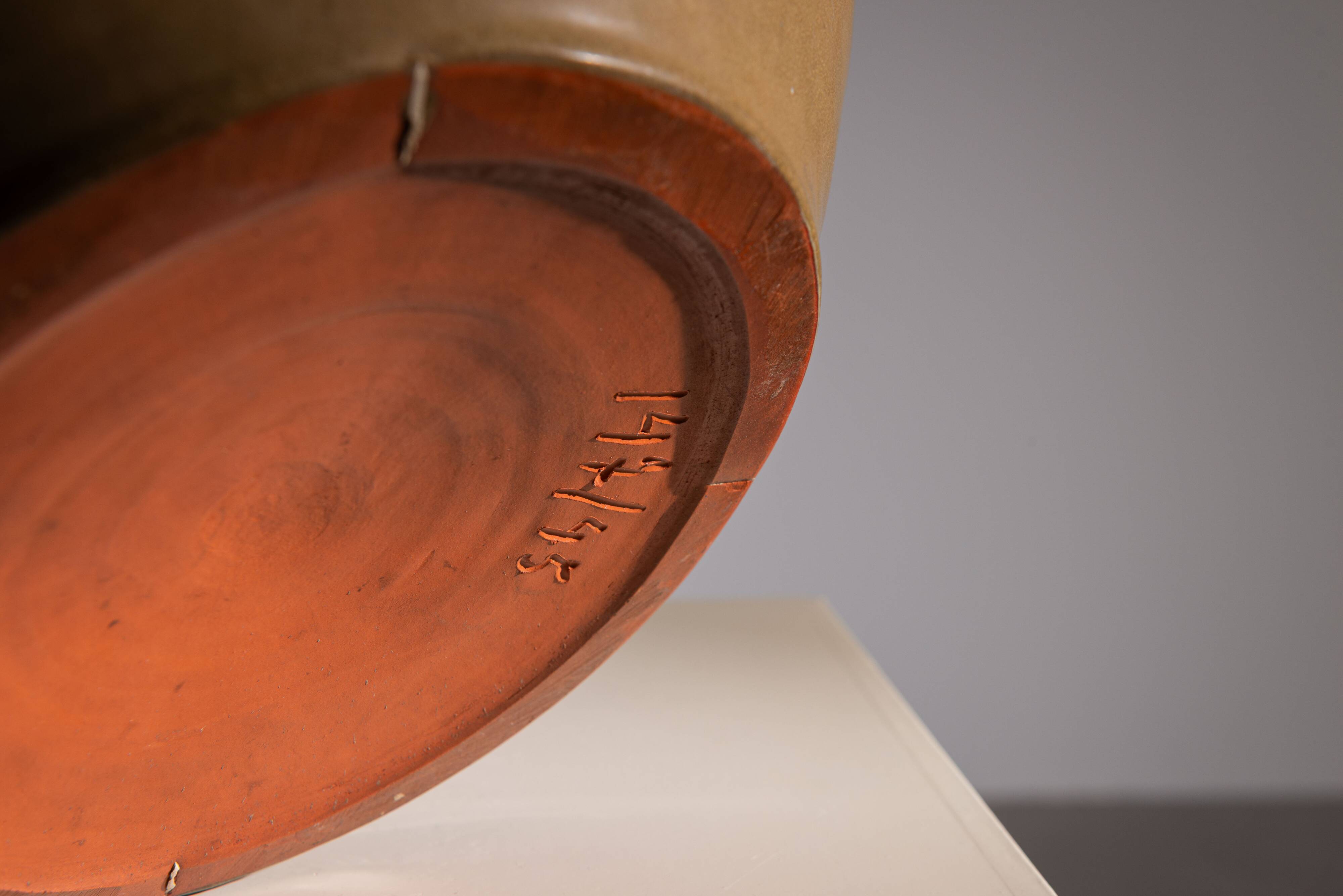 Minimalist curved stoneware vase in matte sand finish