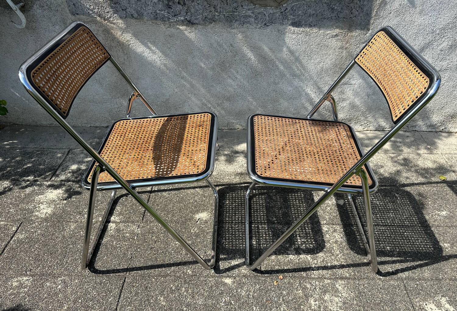 Pair of vintage metal caned folding chairs