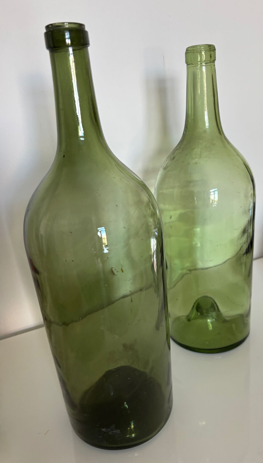 Pair of large antique blown glass bottles