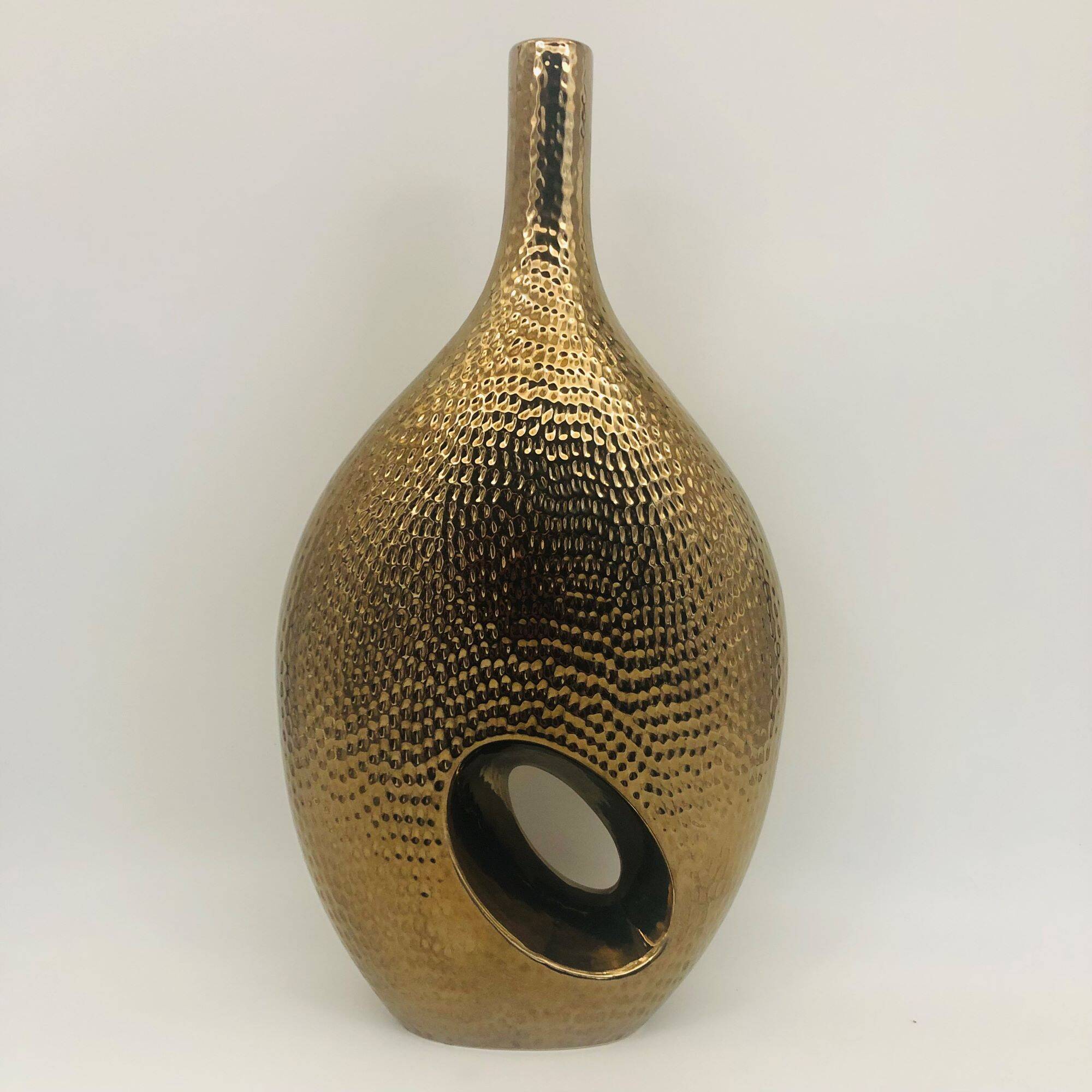 Golden ceramic vase.