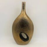 Golden ceramic vase.