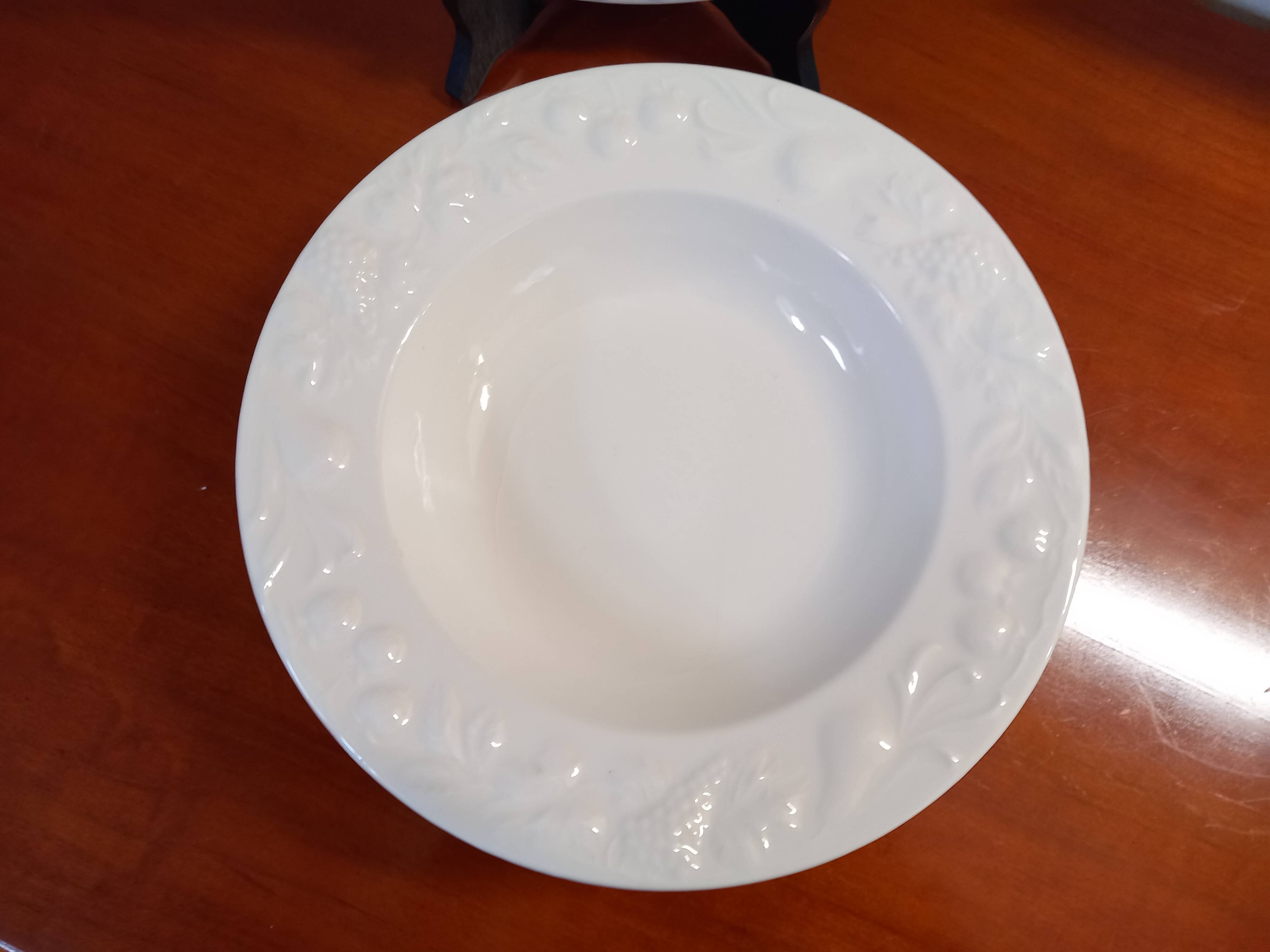 Set of 6 white ceramic deep plates made in Italy.