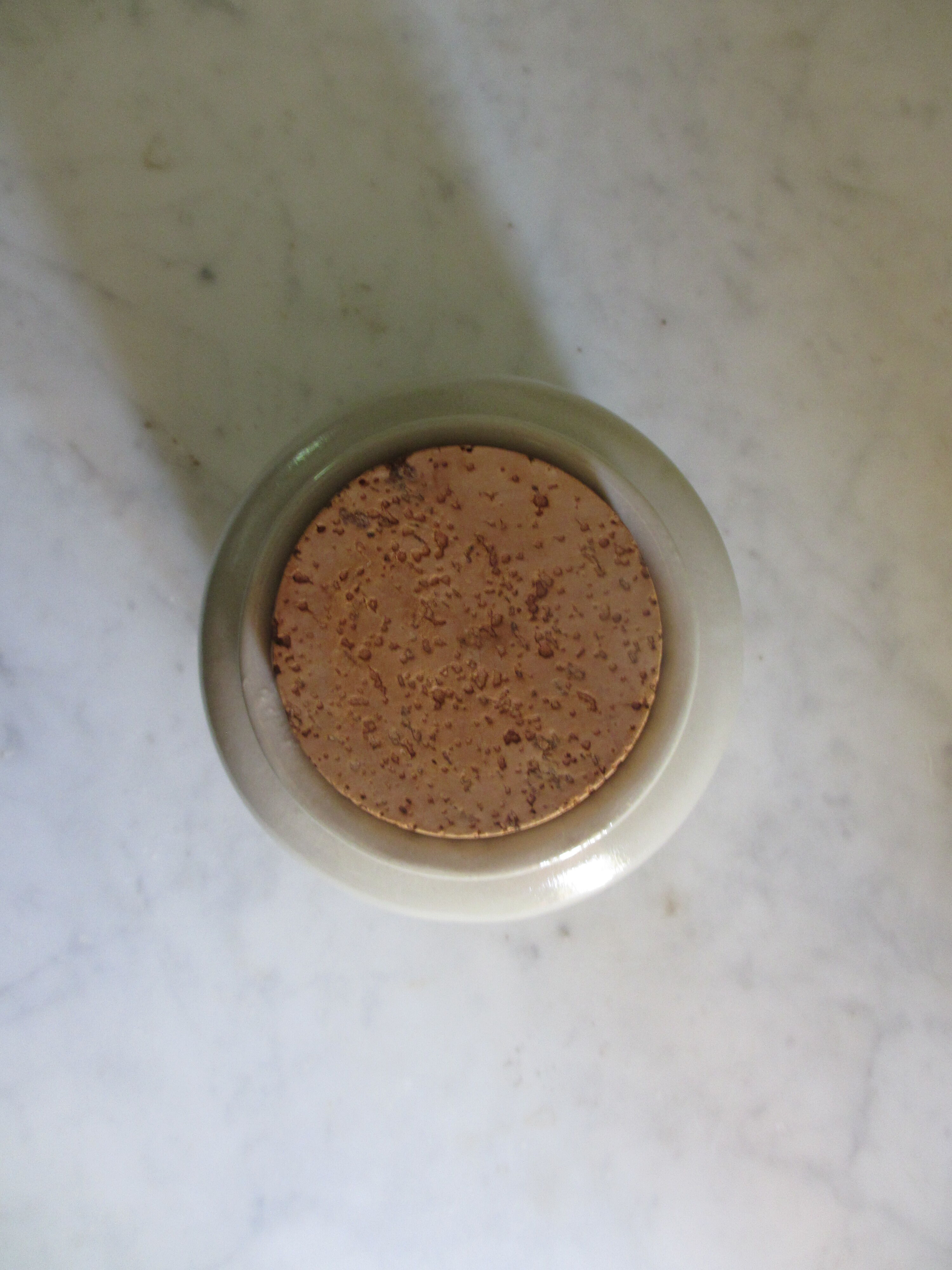 Sandstone pot with its cork cotted