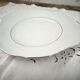 Porcelain mignardise dish with ear handles, double gold line manufacture.