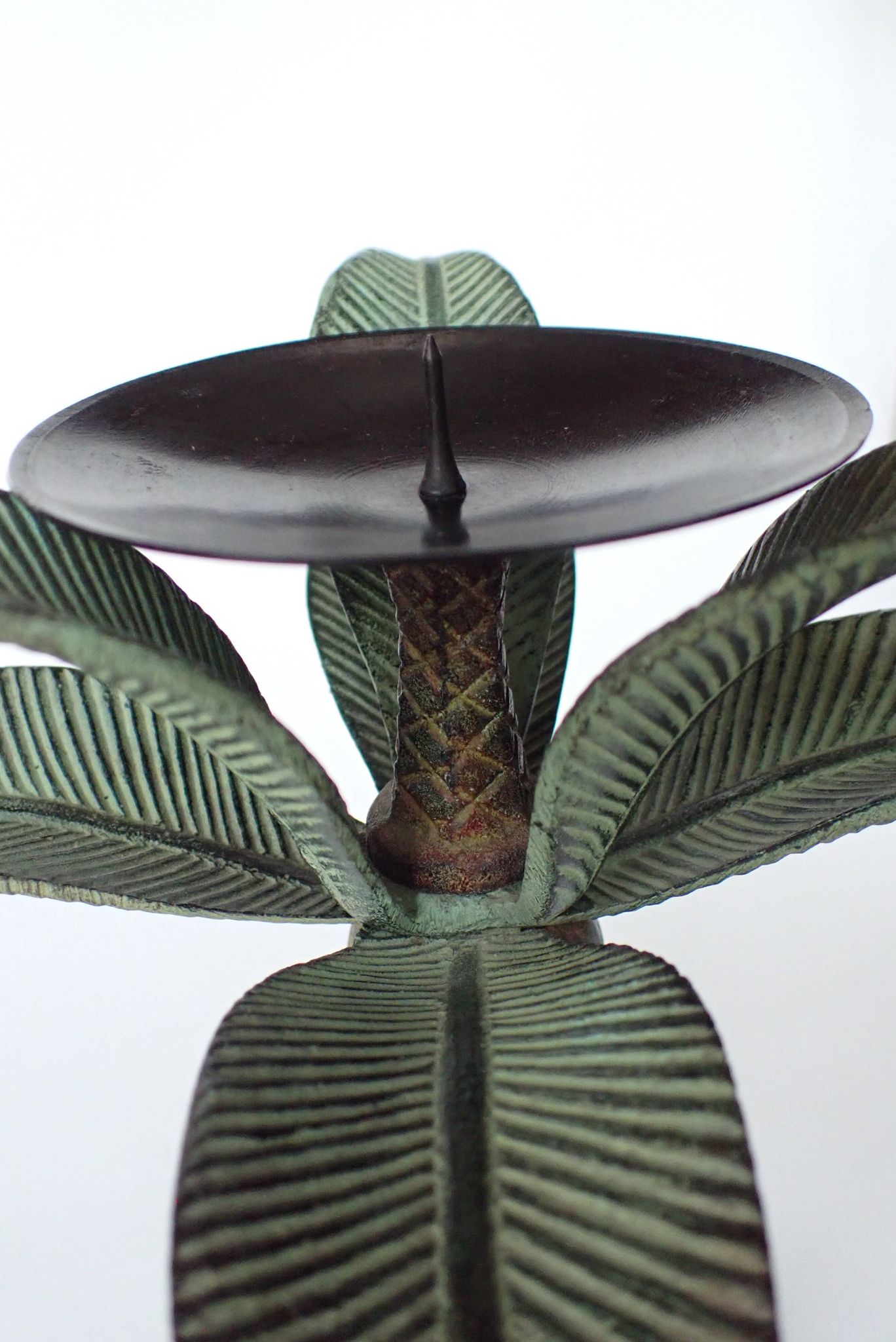 Antique palm tree-shaped candlestick in patinated metal