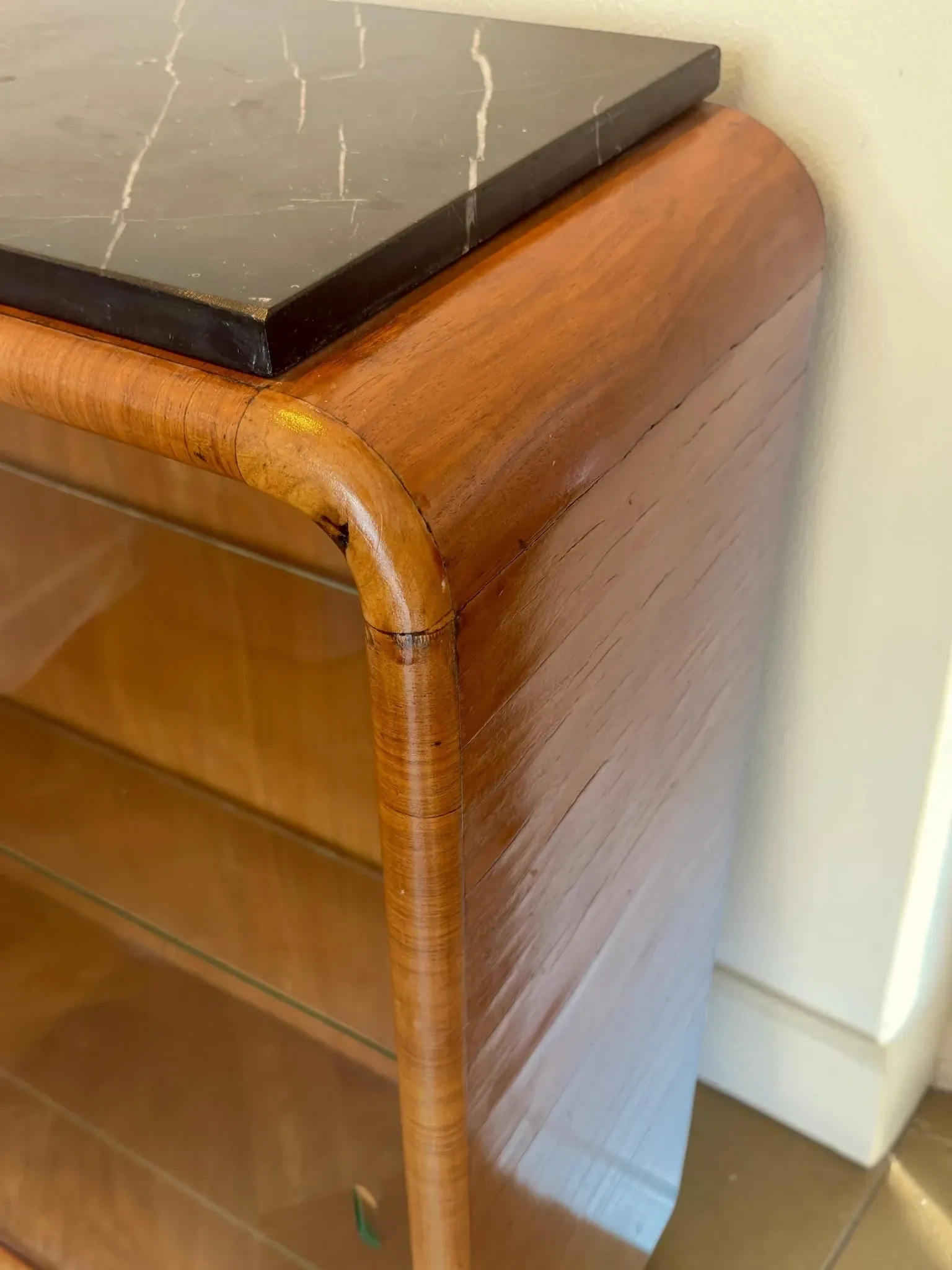 Vintage Art Deco display cabinet in mahogany with a black marble top.