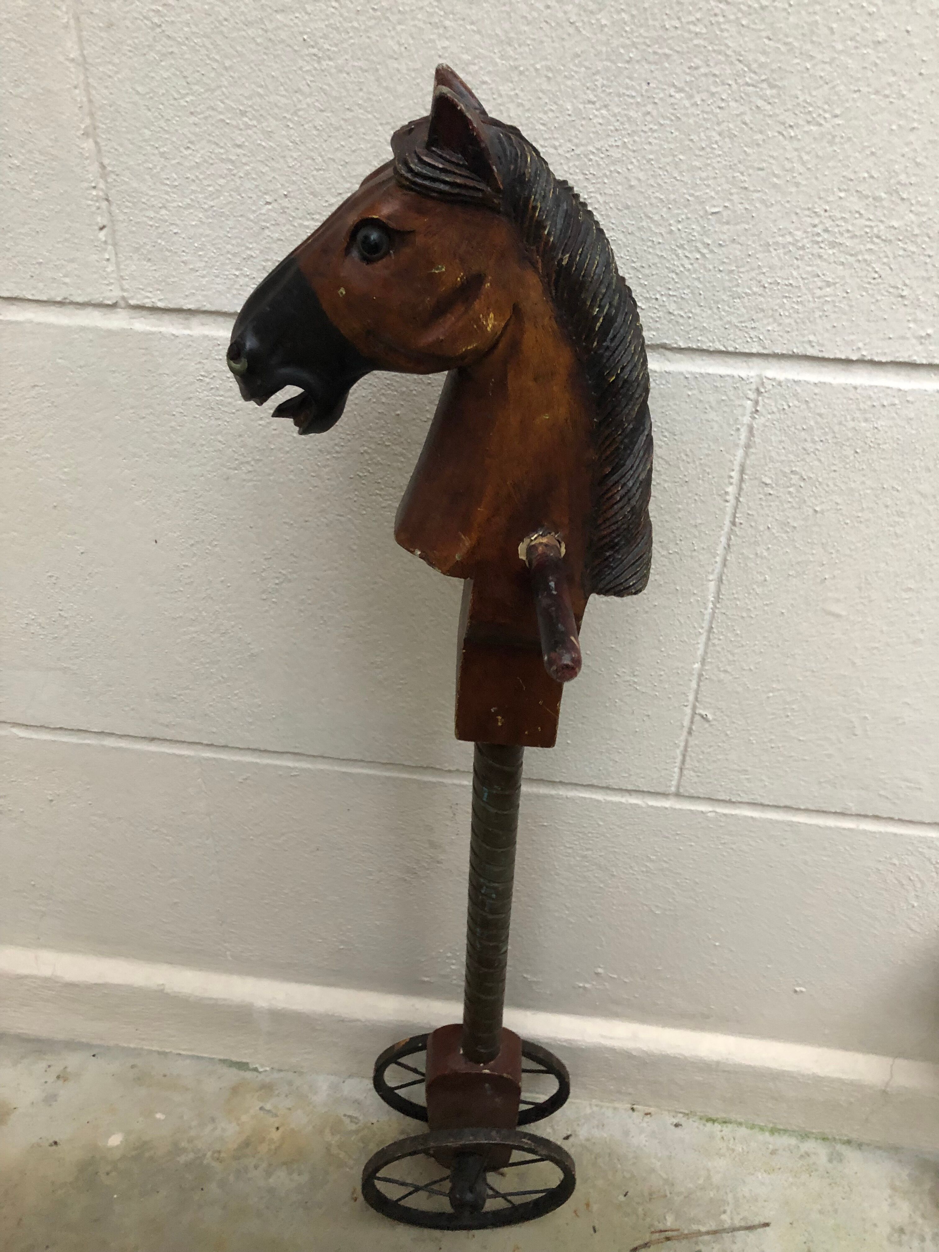 Wooden horse on stick