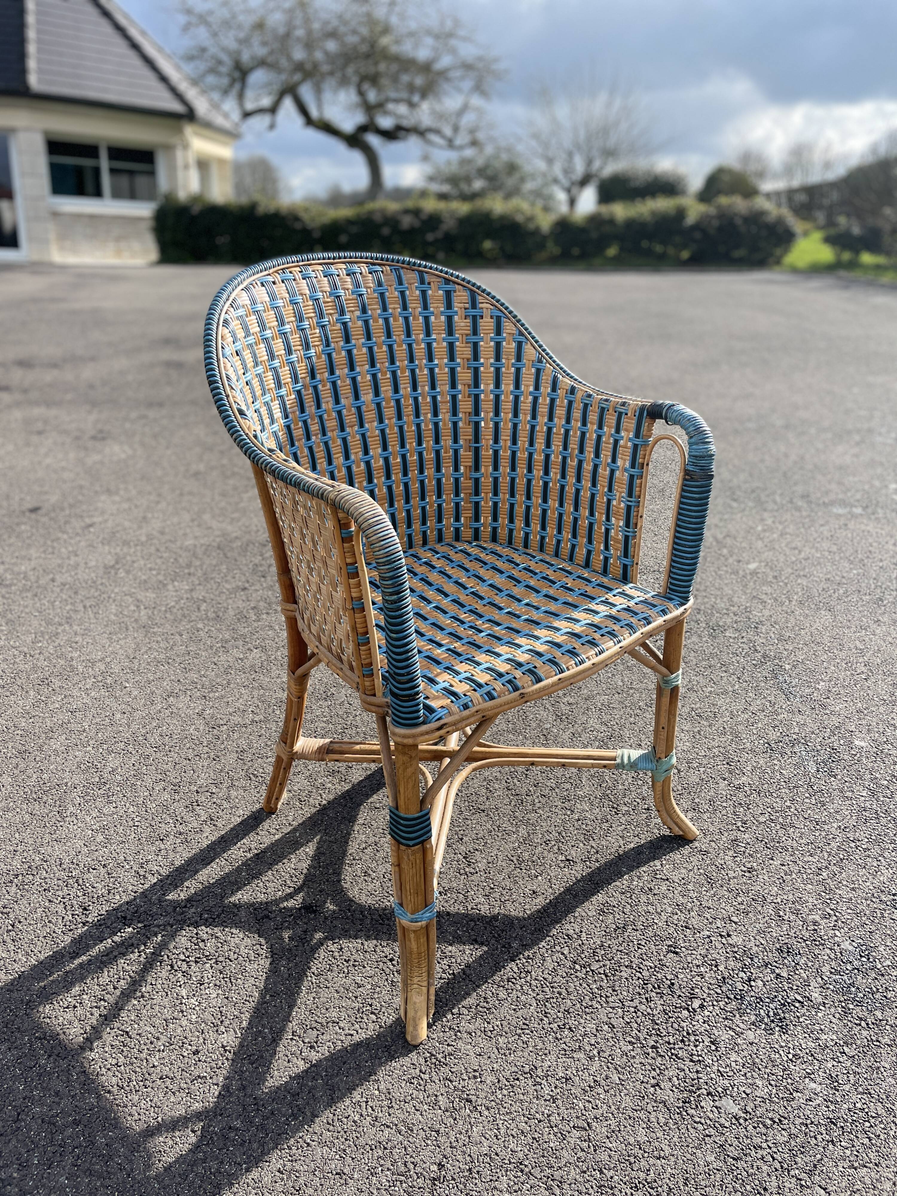 Old vintage woven and rattan wicker armchair 1930