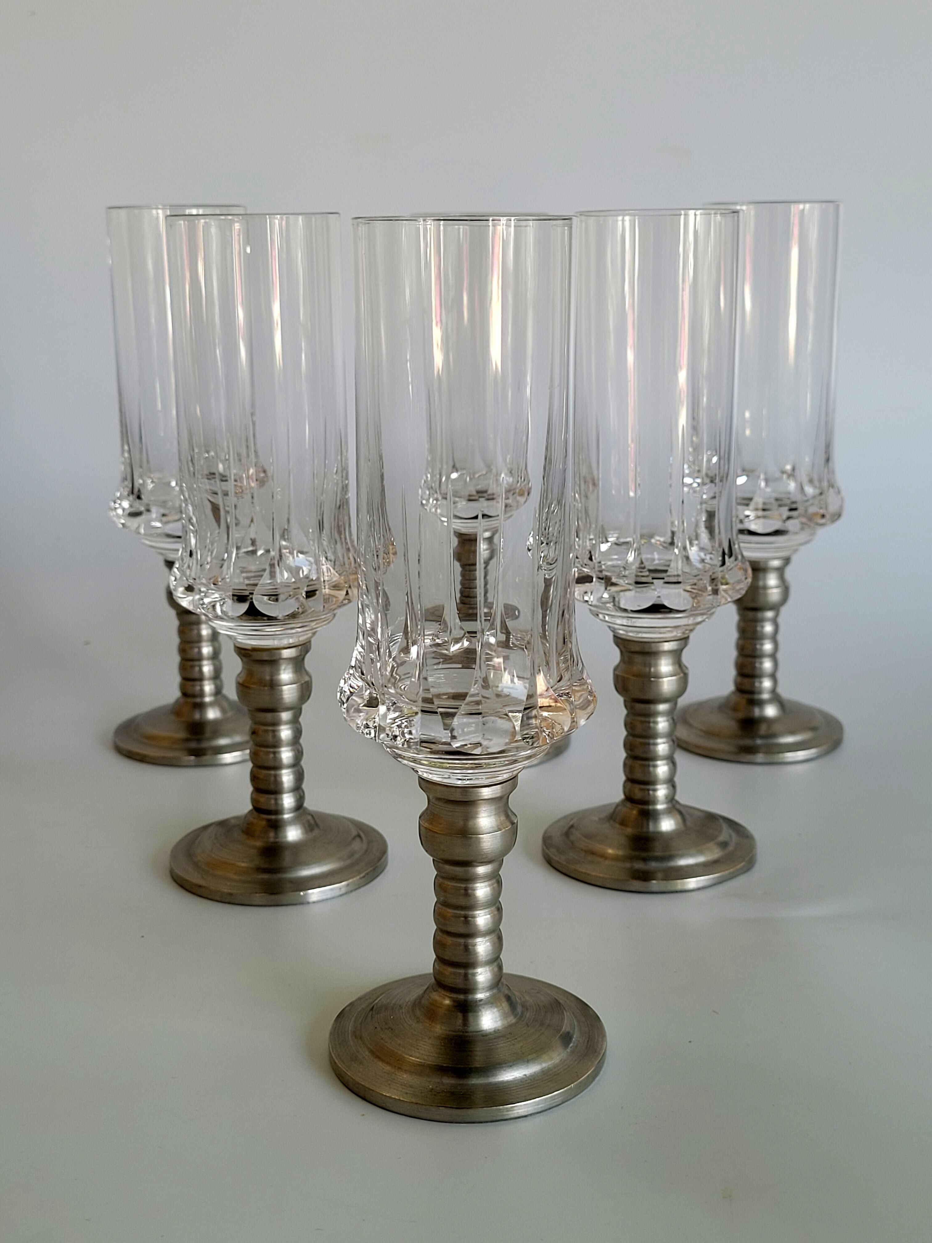 Series of six crystal champagne flute glass with tin foot
