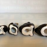 Four little black and golden ducks.