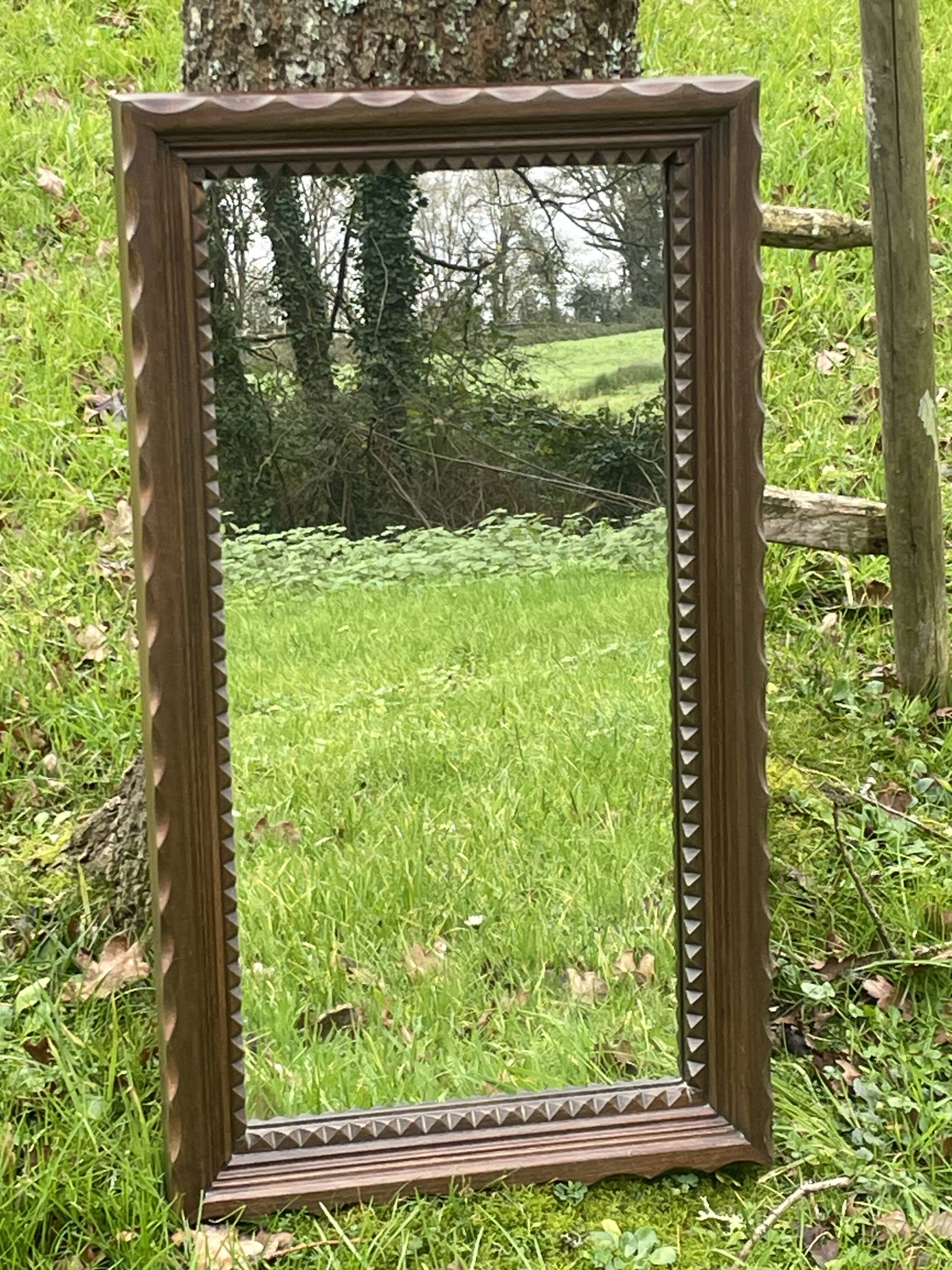 Rustic mirror called brutalist, molded carved natural wood
