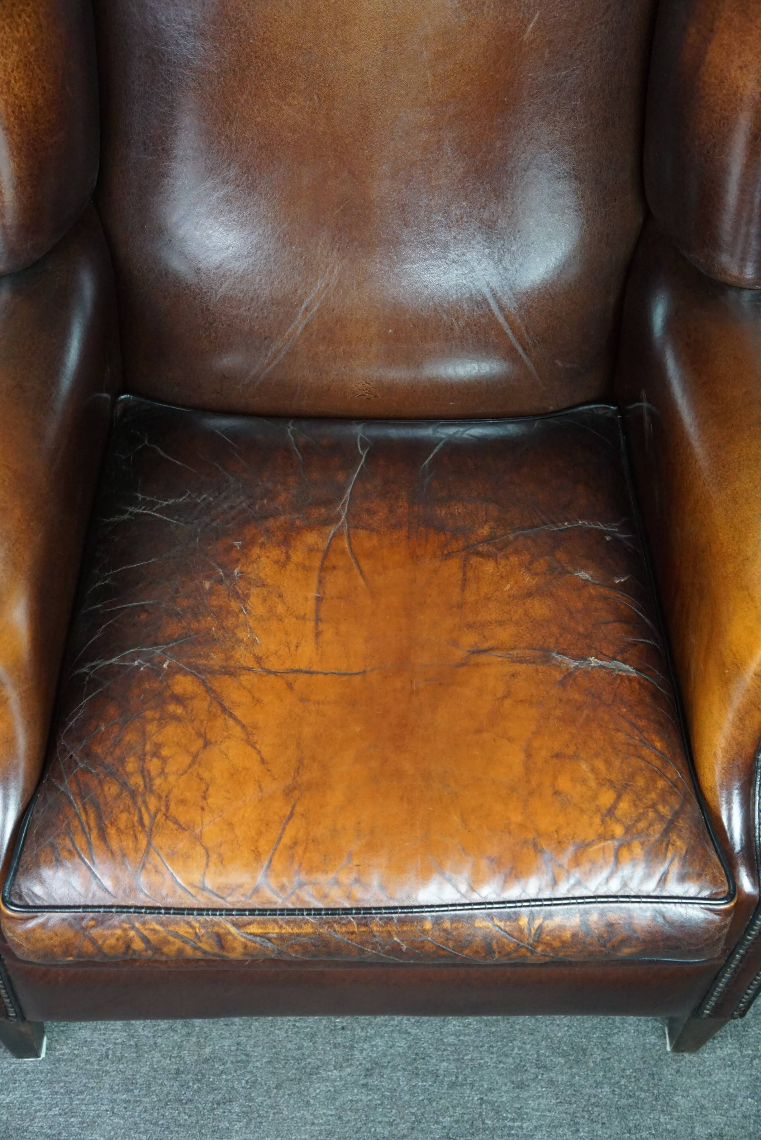 Luxurious large sheep leather wingback armchair with beautiful colors and amazing patina
