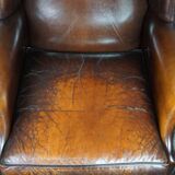 Luxurious large sheep leather wingback armchair with beautiful colors and amazing patina