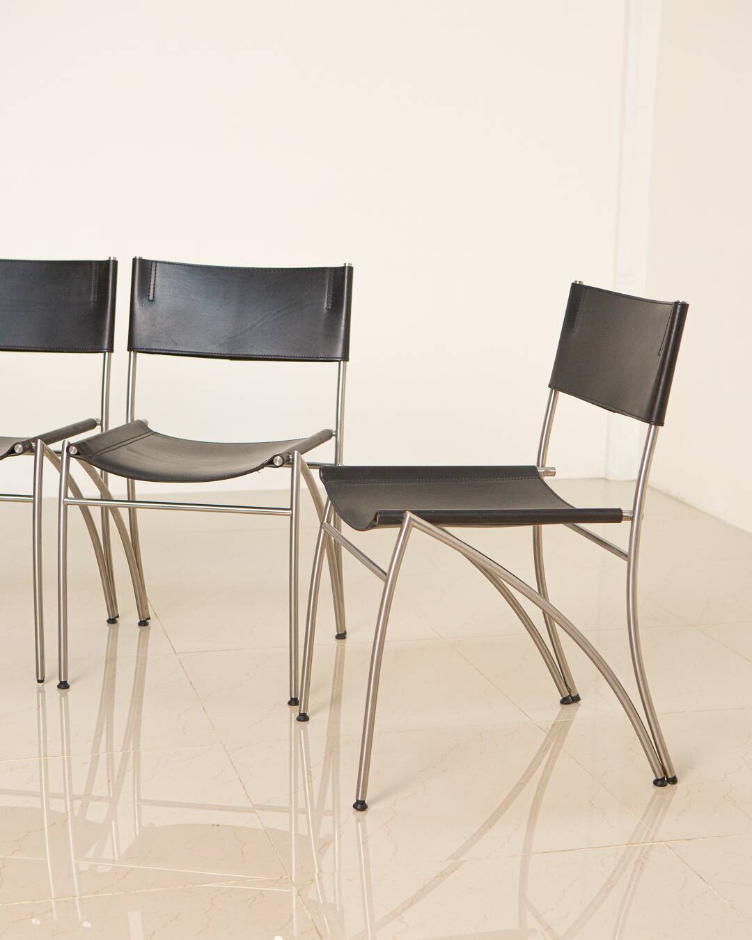 4 Italian black leather chairs from the 80s