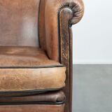 Sturdy vintage sheepskin club armchair with a beautiful patina