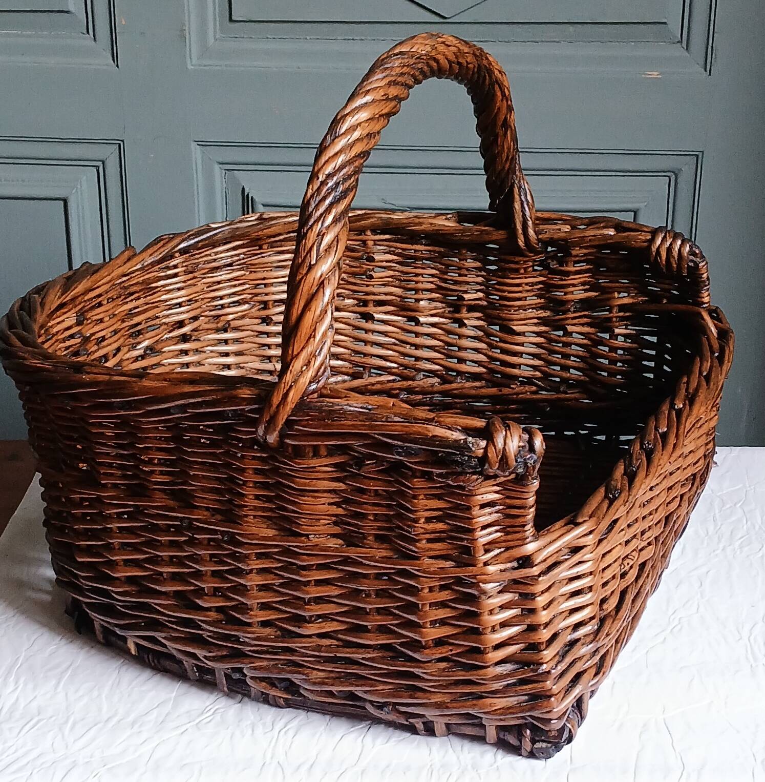 Handmade woven and dyed willow harvest basket.