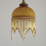 Vintage French amber mottled glass hanging ceiling light with beaded fringe.