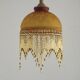 Vintage French amber mottled glass hanging ceiling light with beaded fringe.