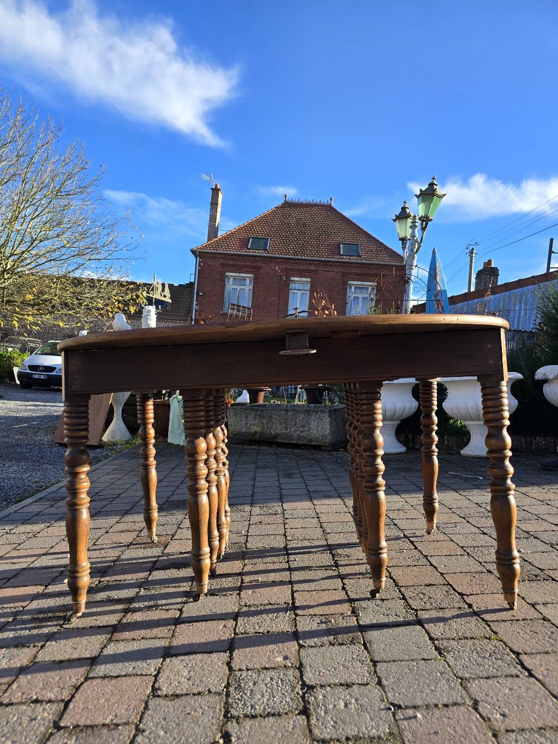 12-foot round oak table with 7 extensions / 20 people