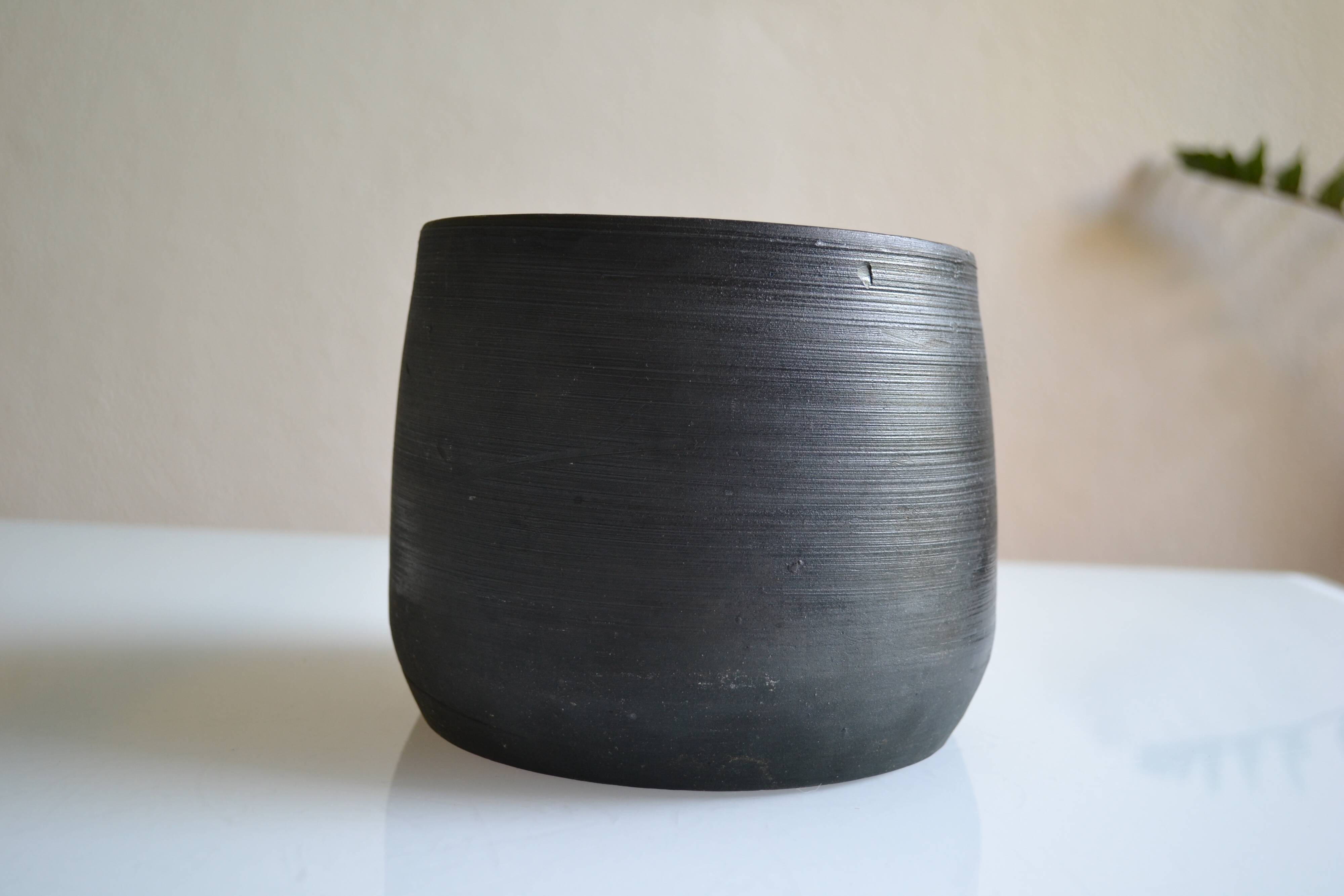 Ceramic cache pot or pocket emptying dish with a signature fish to identify.
