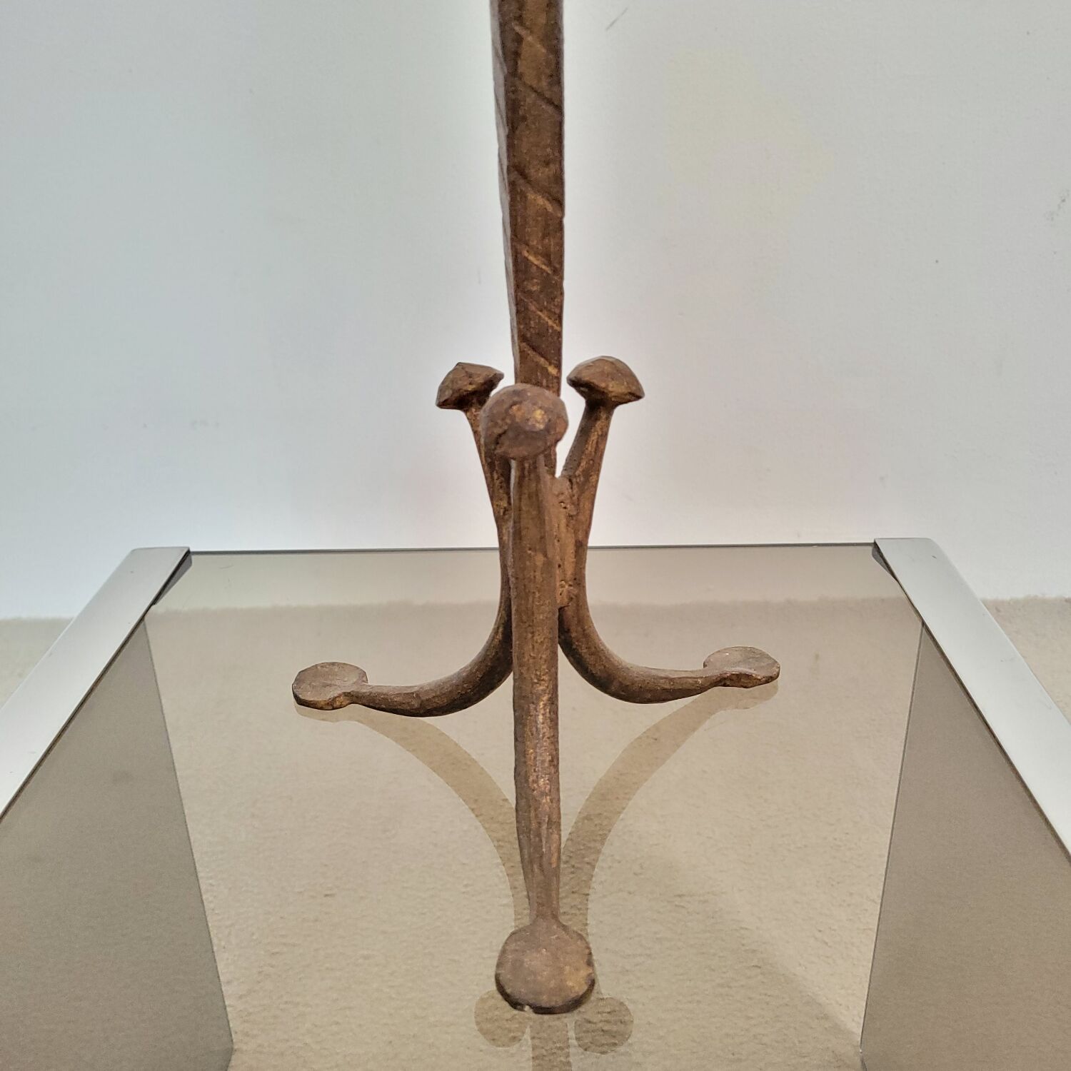 Candle holder in hammered metal with golden patina from the 70s