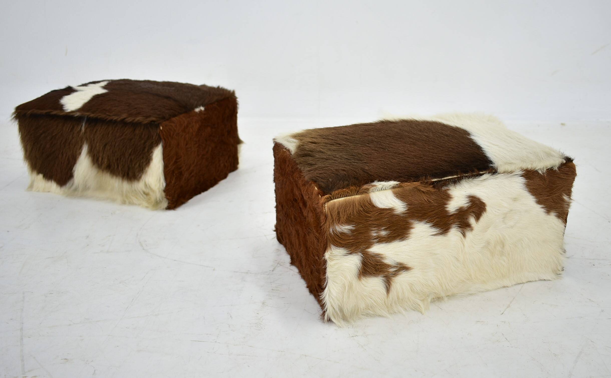 red brown leather cowhide footstools , poufs, 80s
