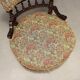 Victorian armchair with fabric pouf, England, 19th century.