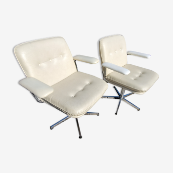 Pair of cream-like swivel chairs
