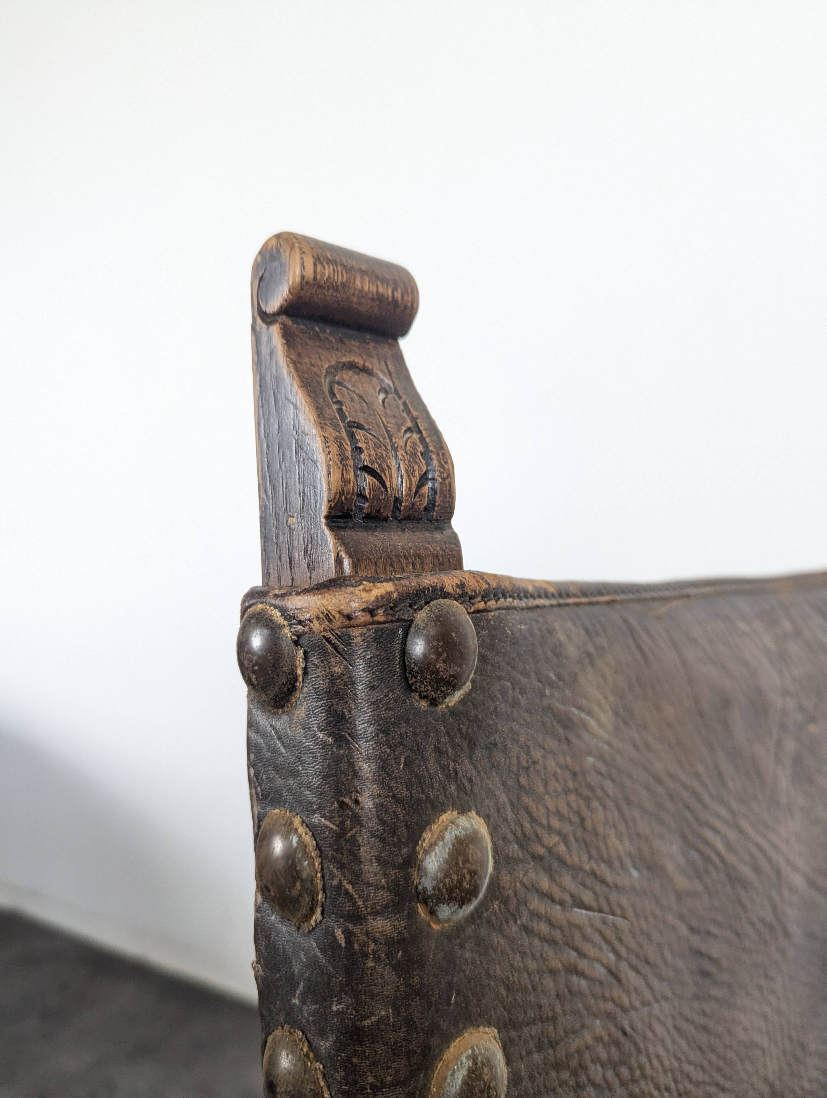 Set of 8 Gothic-style chairs in oak and studded leather.