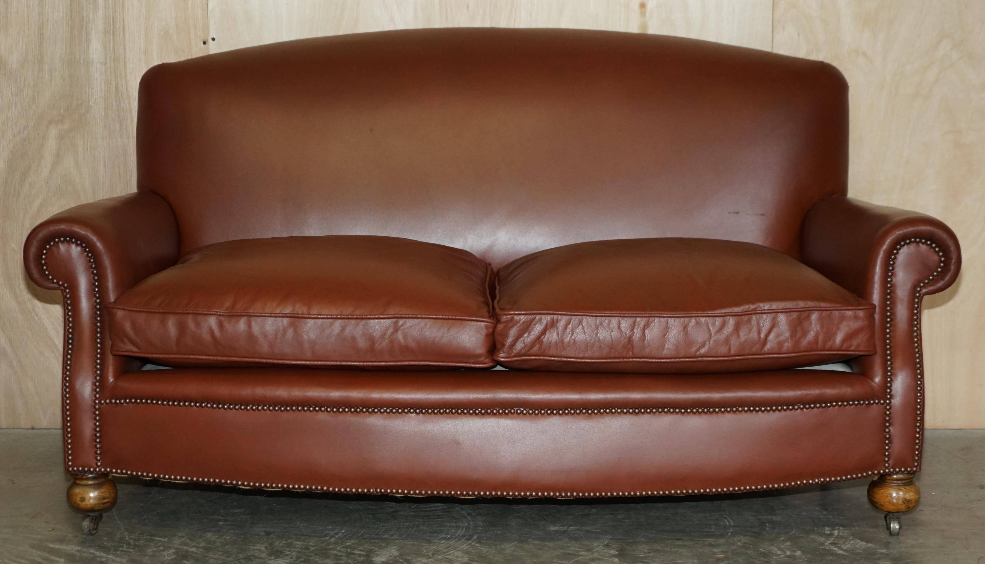 Edwardian leather club canapé circa 1910 with feather cushions.