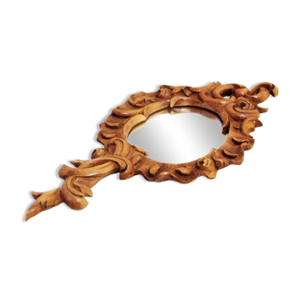 Carved wooden hand mirror