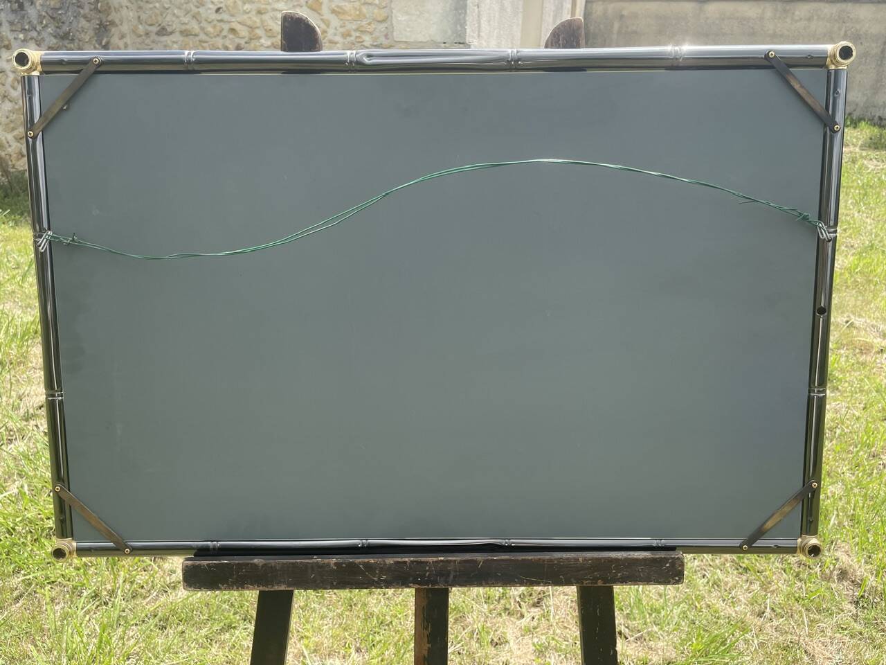 Vintage rectangular wall mirror in tubular metal and brass, 1970s/1980s.