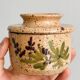 Small speckled ceramic butter dish, hand-painted decoration.