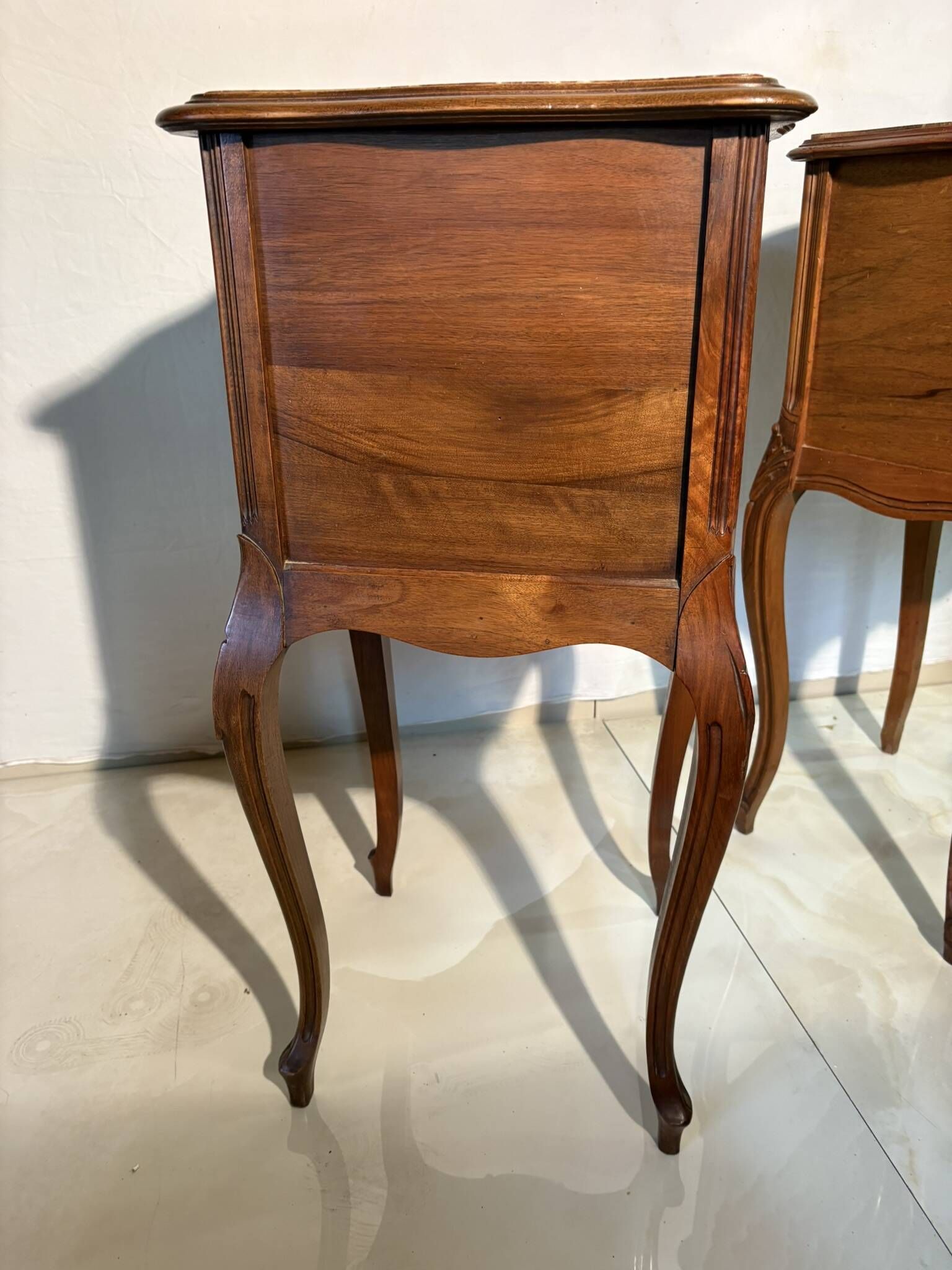Pair of antique bedside tables with marble top and ceramic niche